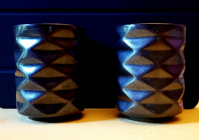 Ceramic mugs in the shape of a Yoshimura crease pattern