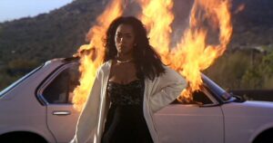 Black woman powerfully walking away from car that is on fire (from Waiting to Exhale)